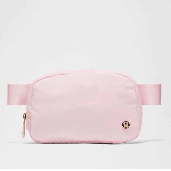 lululemon athletica Handbags - Lululemon Everyehere Belt bag GoLD / pink Pink Belt Bag new s tags nwt